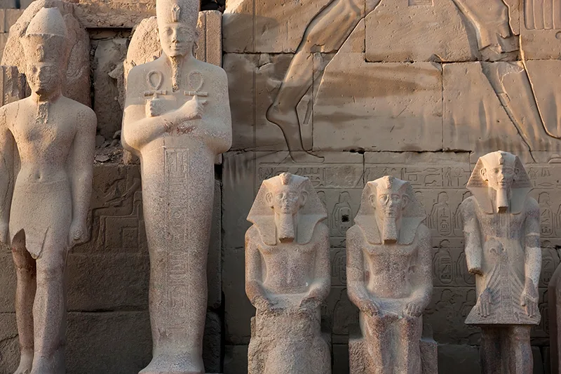 row-of-ancient-egyptian-stone-sculptures-of-pharao