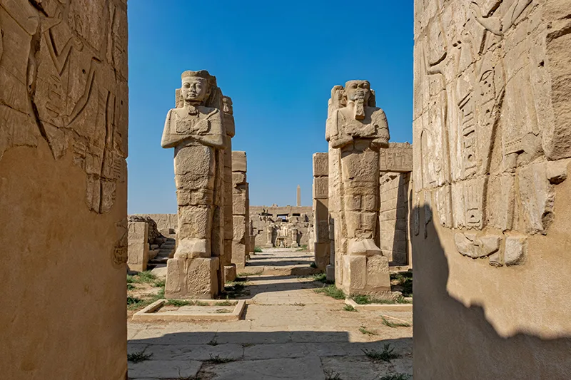 tall-statues-by-the-karnak-temple-on-blue-sky-back
